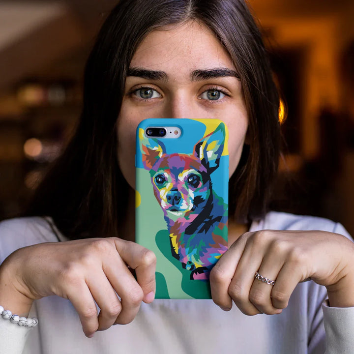 Person holding a phone with a colorful dog design case