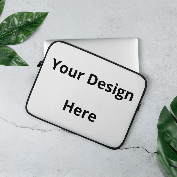 White pouch with 'Your Design Here' text on a light gray surface with green leaves.
